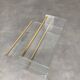 Plexiglass and brass magazine rack from the 70s in Hollywood Regency style.