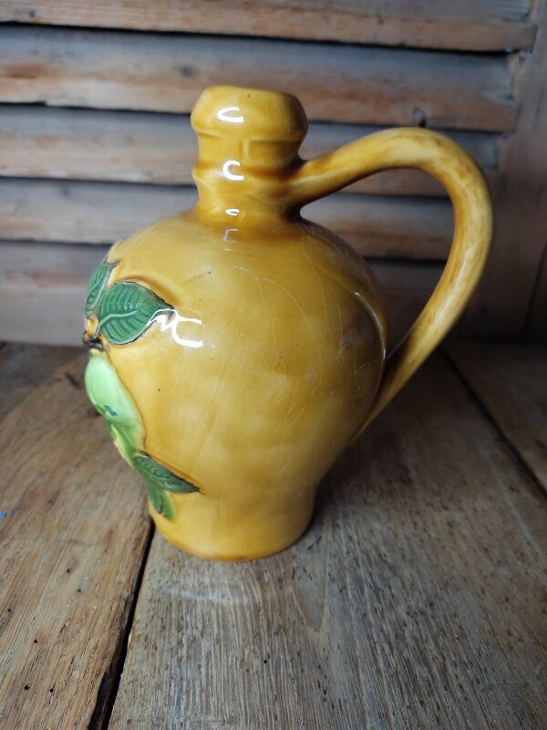 Calvados decanter in vintage antique ceramic