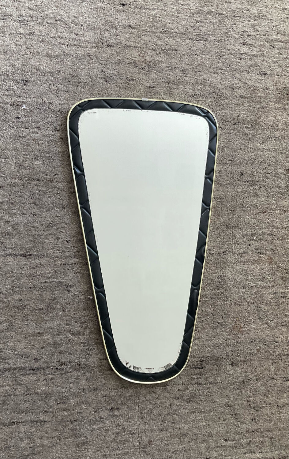 Asymmetrical mirror from the 1960s.