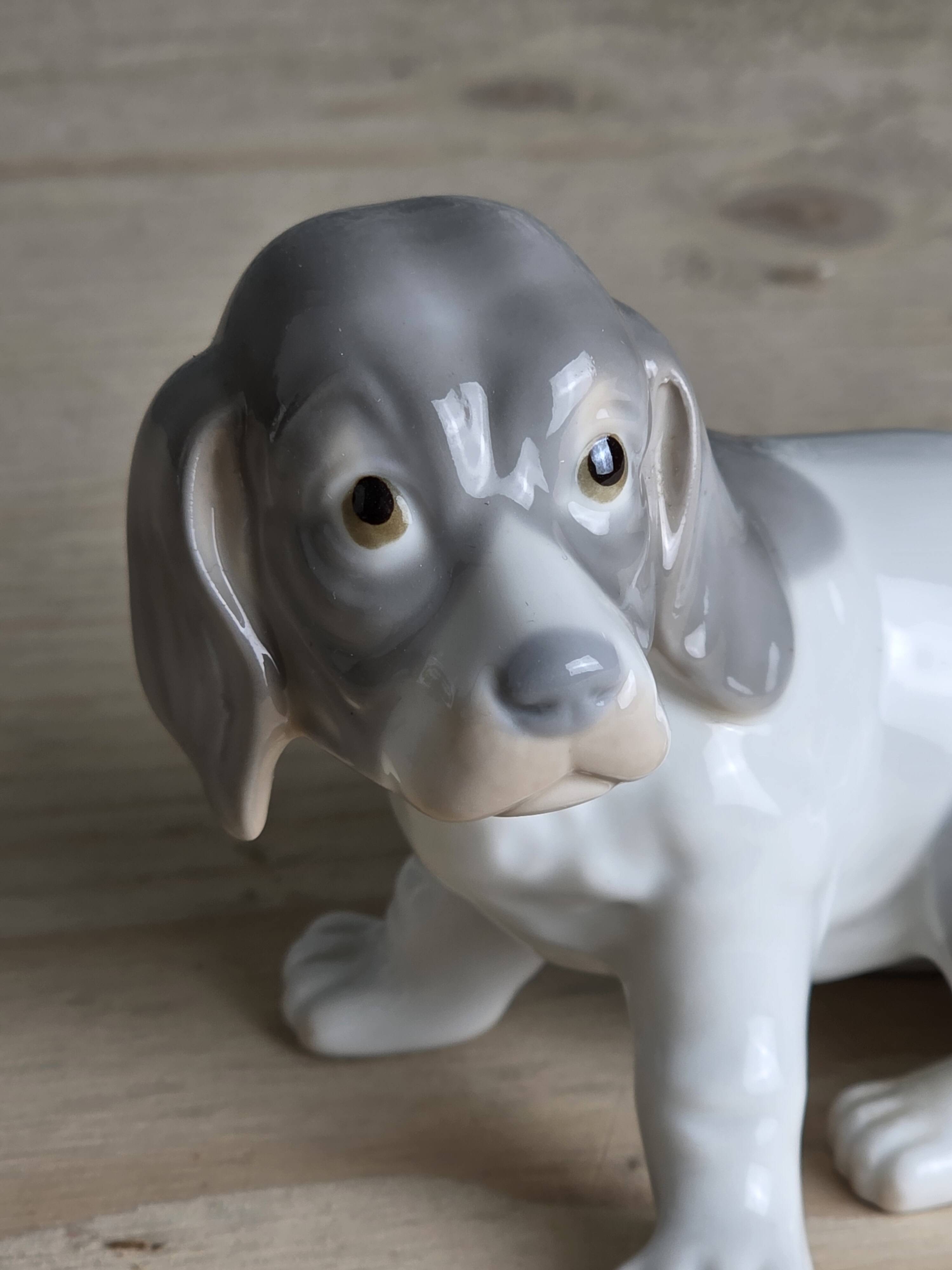 Small spaniel dog in porcelain