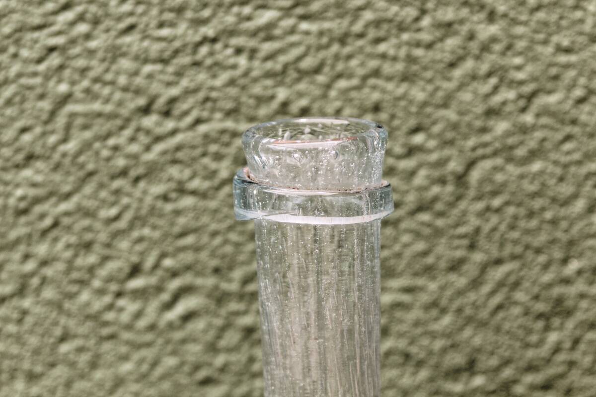 Biot blown glass bottle