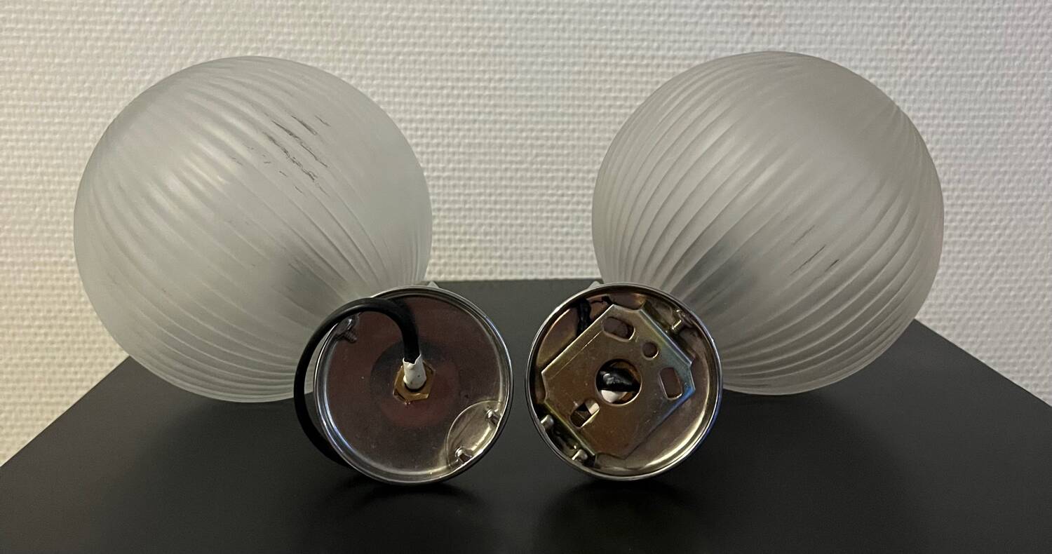 Pair of Inda metal and chiseled glass wall lights