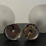 Pair of Inda metal and chiseled glass wall lights