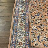 Large wool and silk oriental carpet.