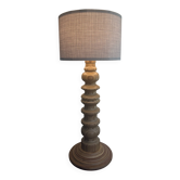 Wooden turned totem lamp with a linen shade in vintage Scandinavian style.
