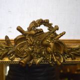 Mirror gilded with musical instruments 75x116cm