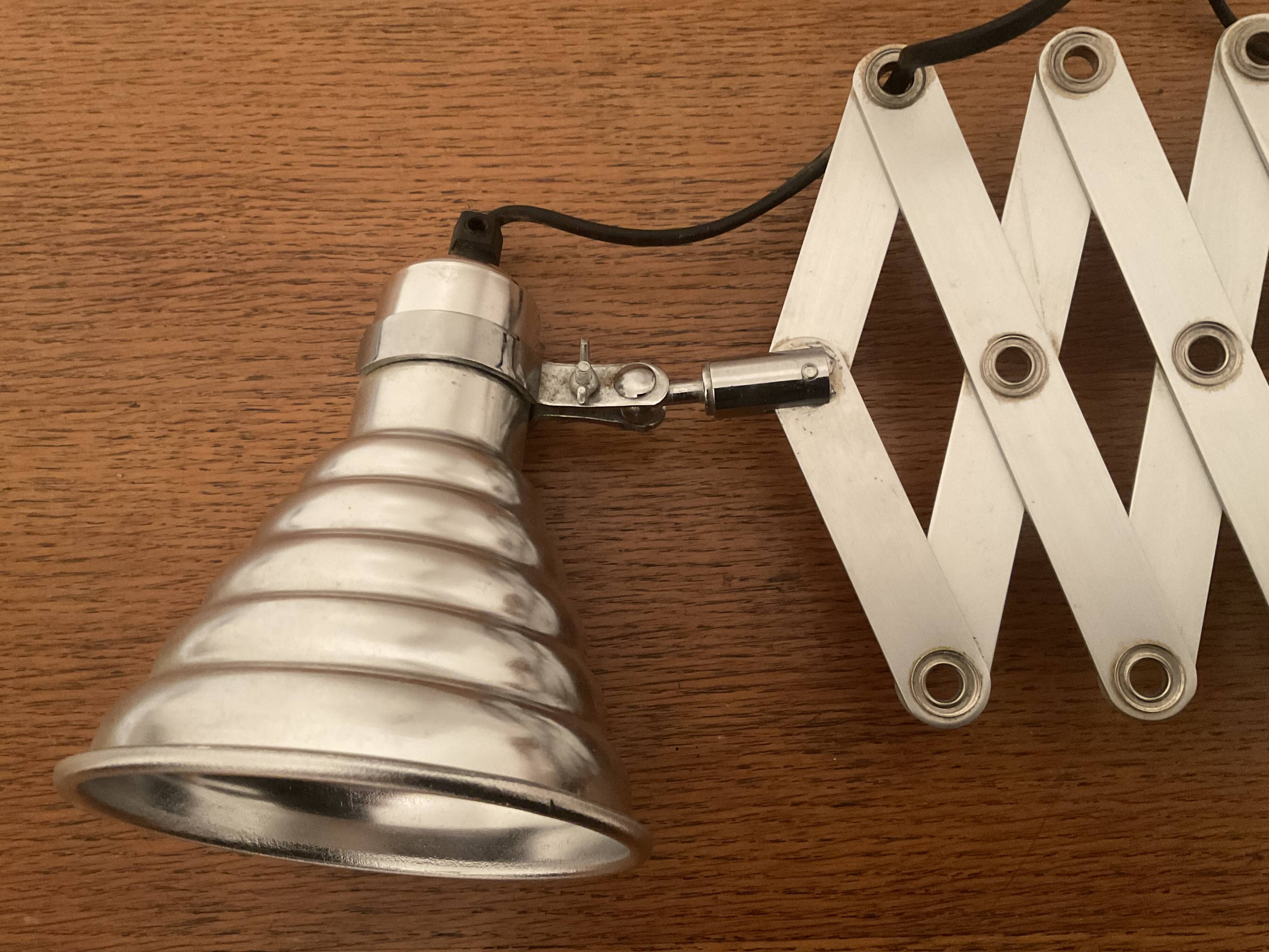 Industrial accordion wall light