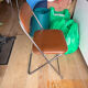 Brown folding chair in vinyl and steel