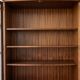 Classic English display cabinet in wood with glass doors.
