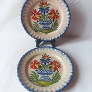 Pair of antique plates in popular earthenware with a floral basket decoration on the edge.