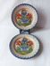Pair of antique plates in popular earthenware with a floral basket decoration on the edge.