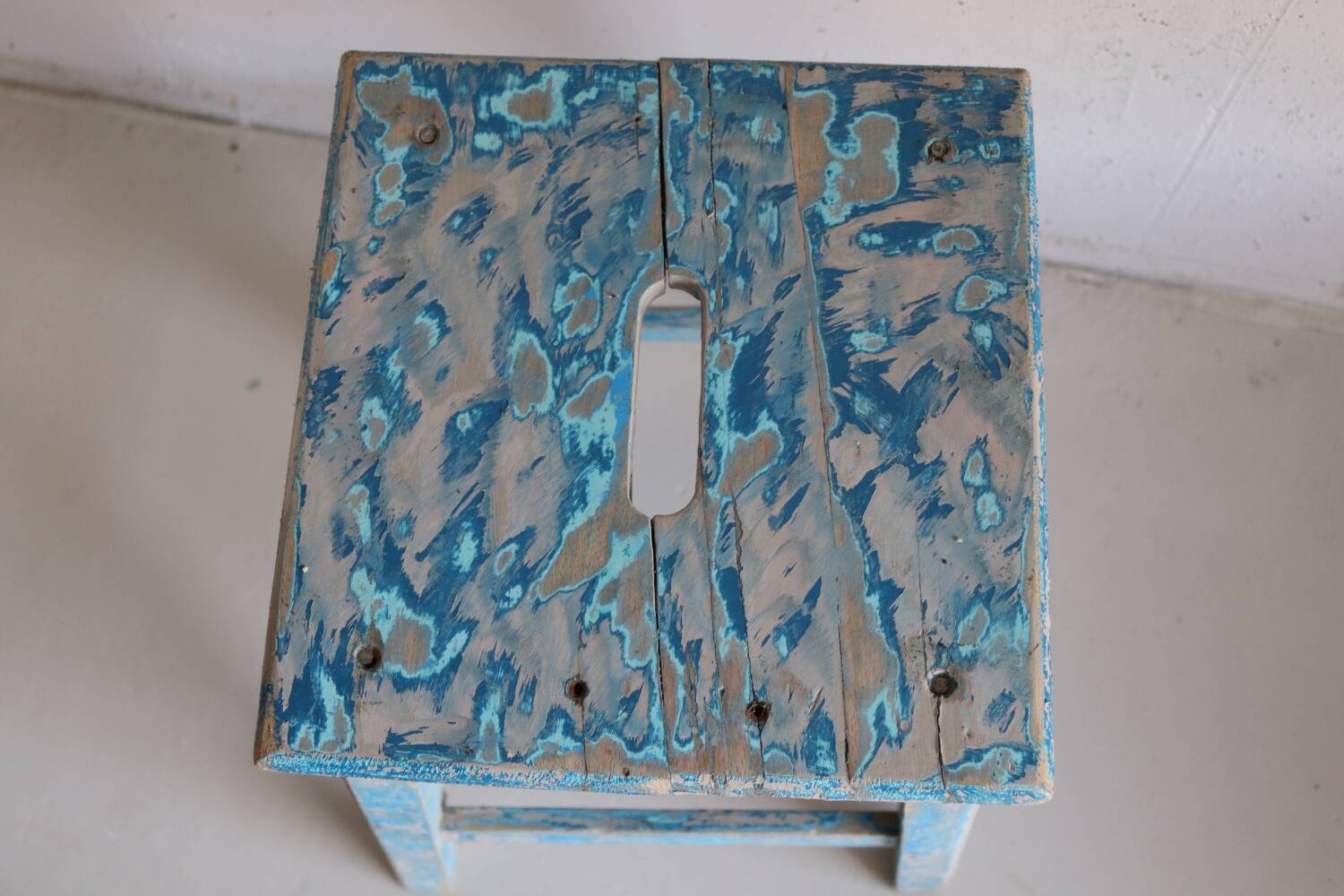 Blue patinated farm stool
