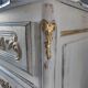 Louis XV style royal chest of drawers patinated