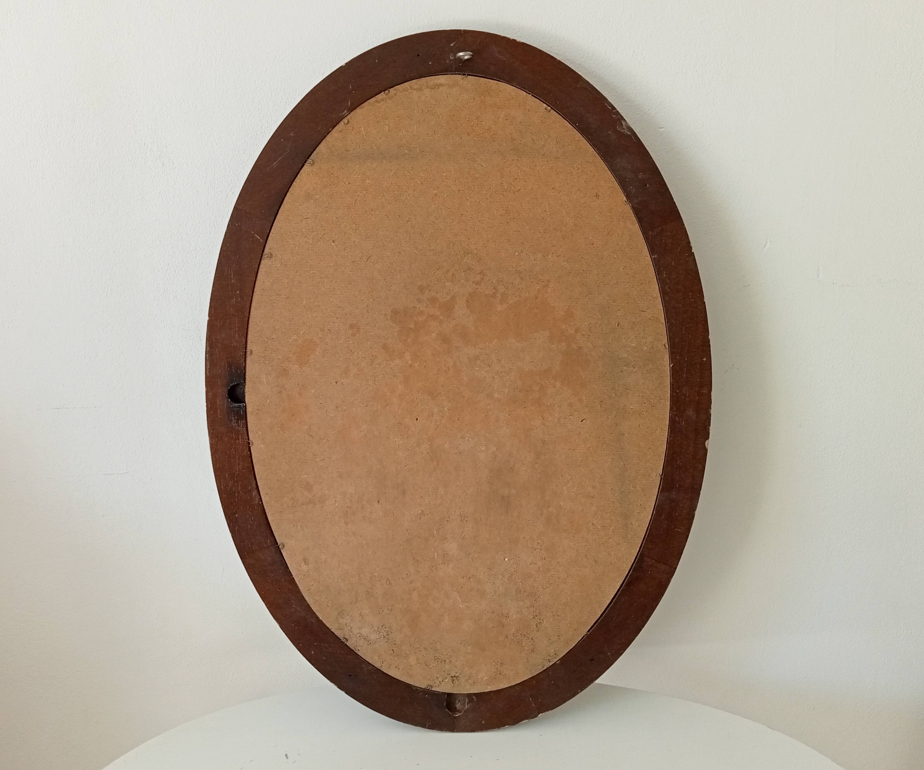 Vintage oval mirror in petrol blue wood