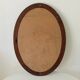 Vintage oval mirror in petrol blue wood