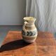 Beige carafe with stylized blue flower friezes