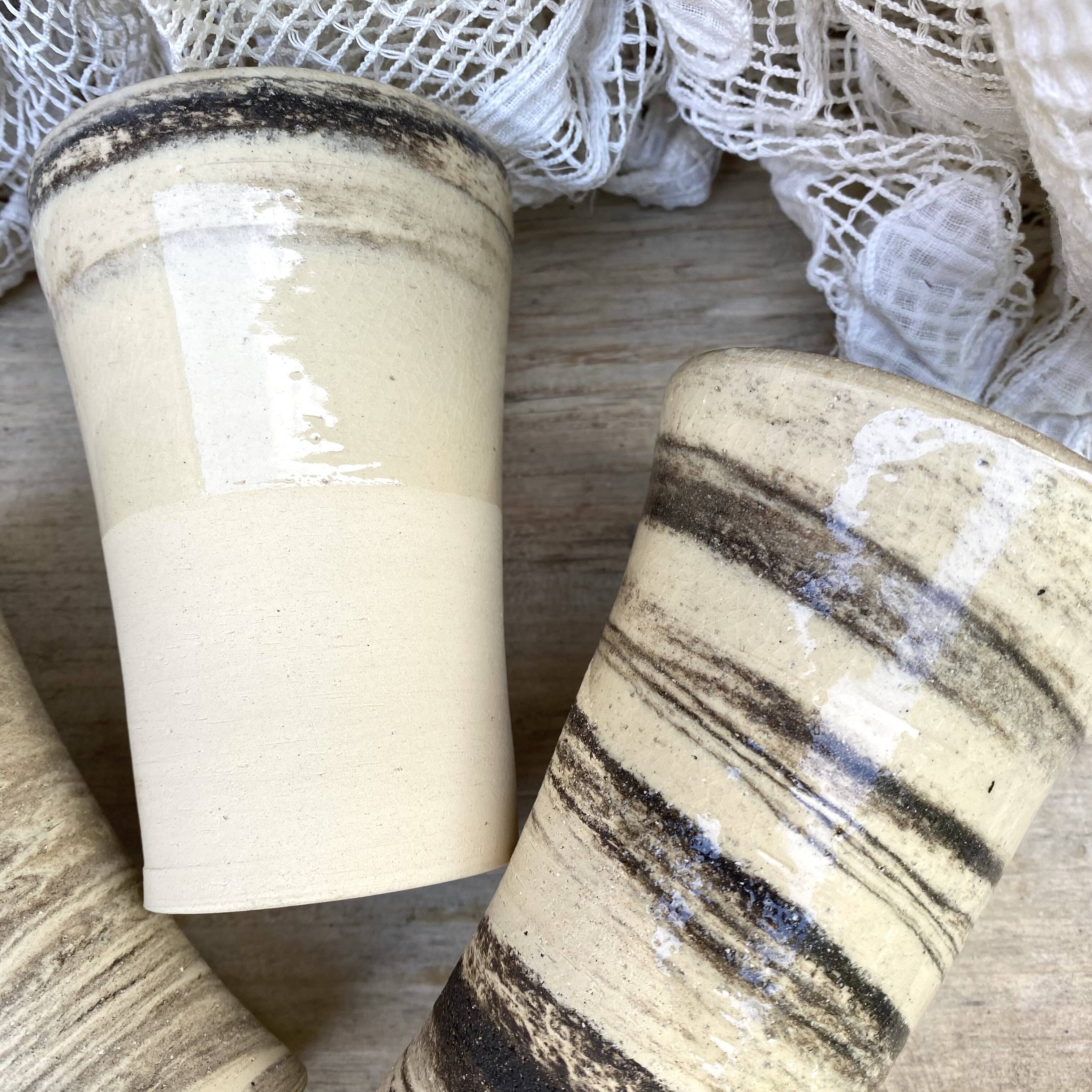 High ceramic cups made of mixed clay.