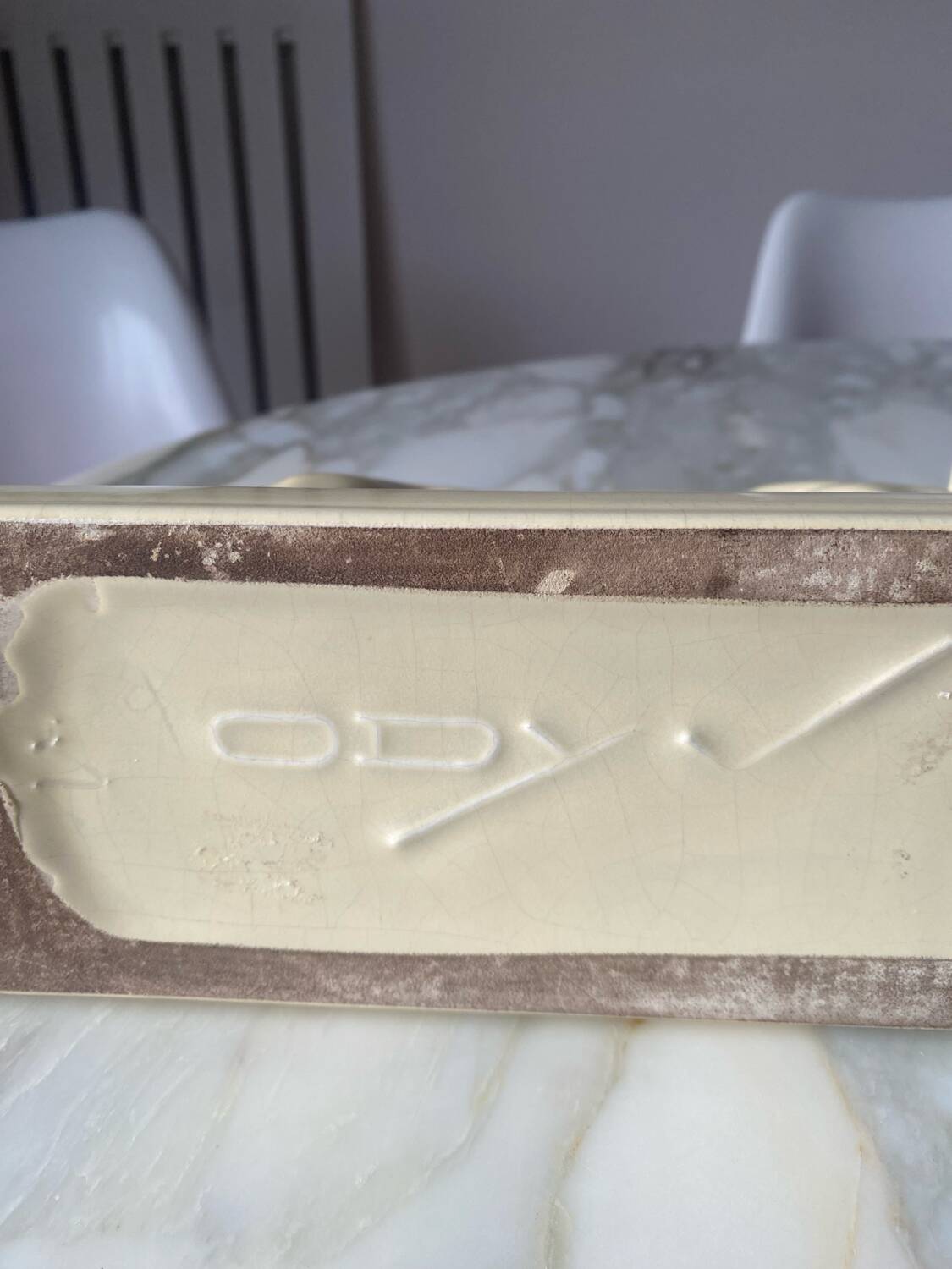 Ceramic of a walking dog brand Odyv