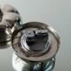 Ensemble vintage Christian Dior en argent massif : deux bols en métal avec couvercle et briquet intégré amovible, années 1970.