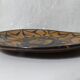 vintage signed glazed terracotta plate in ethnic style