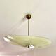 Pale yellow asymmetrical suspension cup 1960