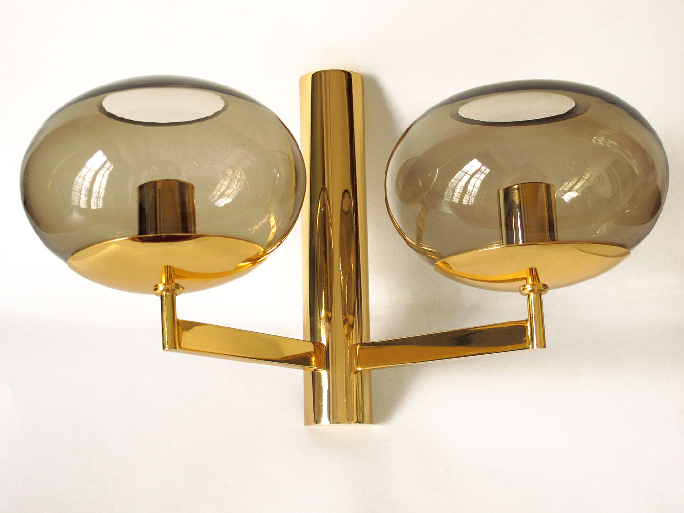 Duo wall lamps. Golden metal and smoked glass from Sciolari 1970