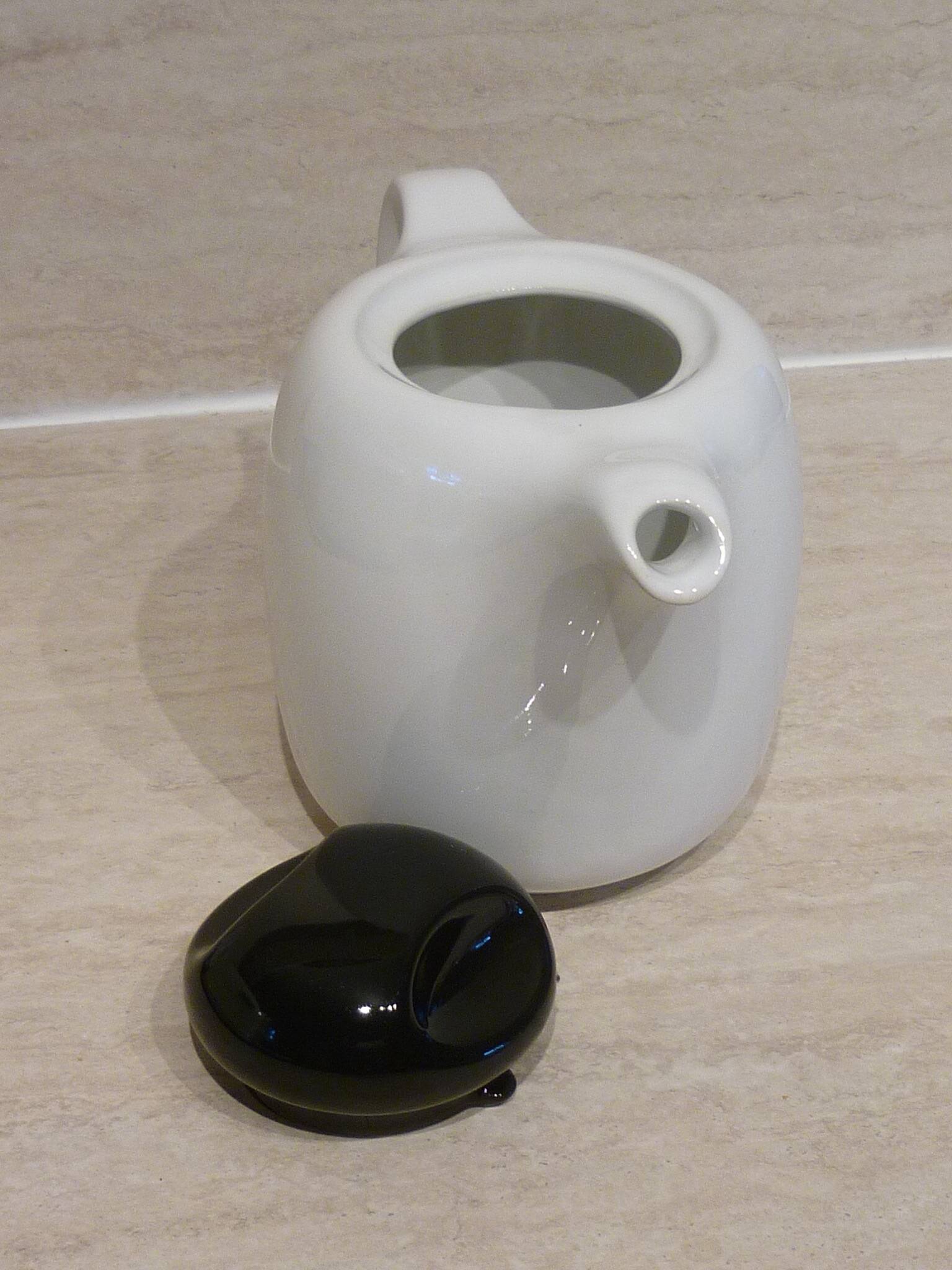 Black and white ceramic coffee maker
