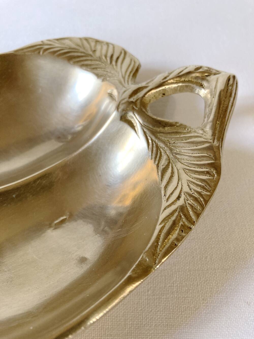 Brass catchall in the shape of an apple.