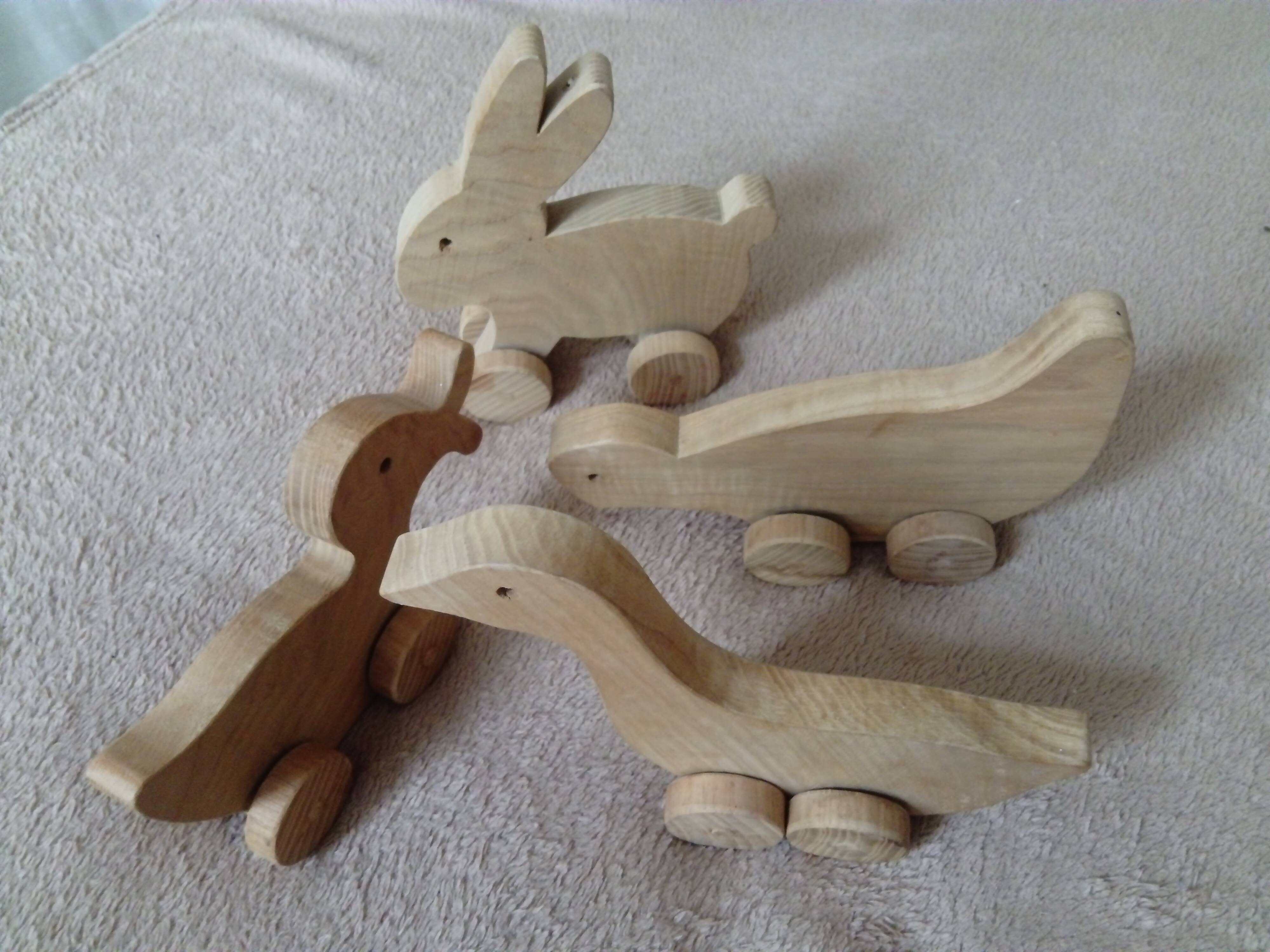 set of 4 wooden toys on wheels