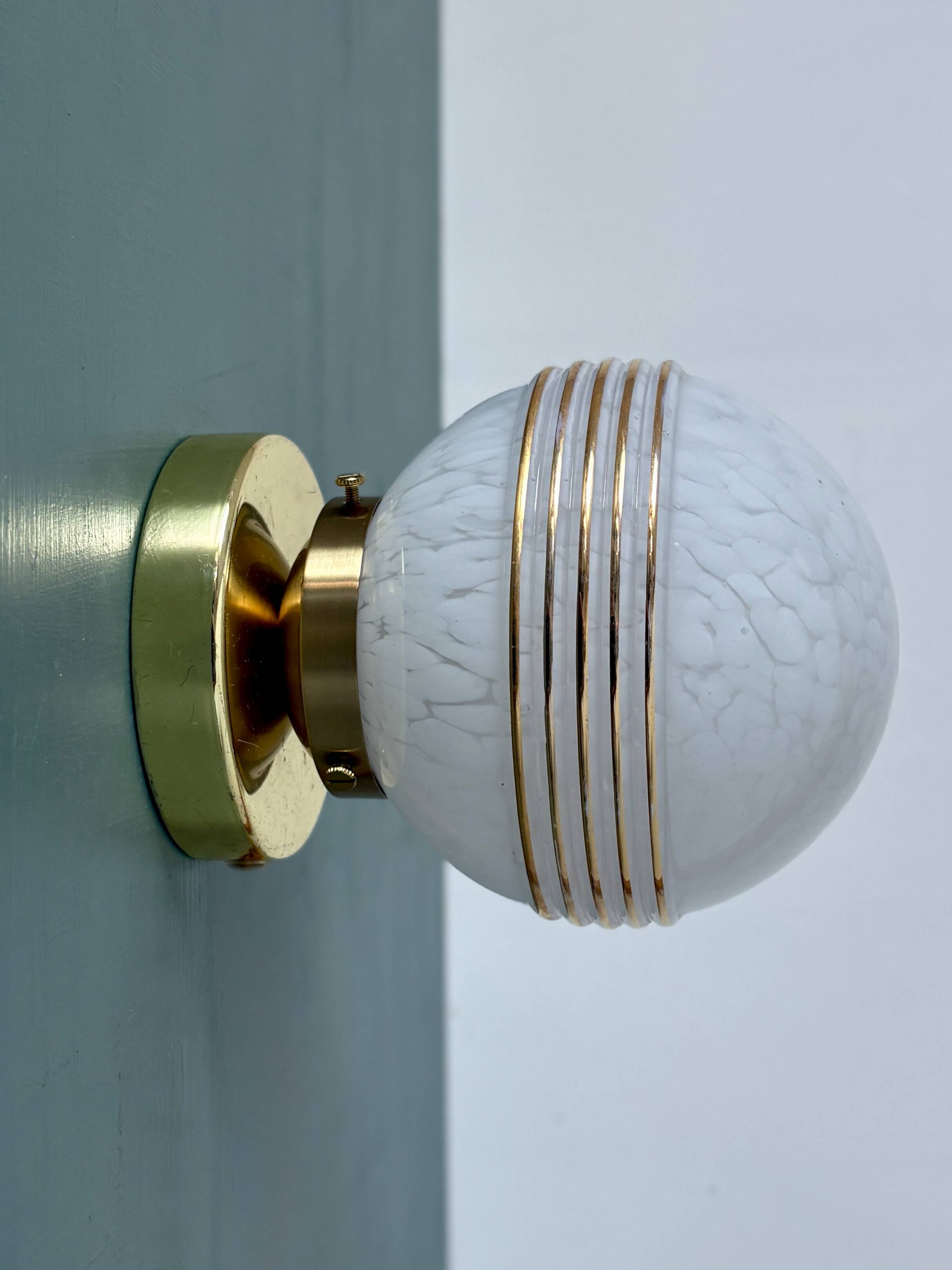 Vintage glass globe wall or ceiling light in white and gold from Clichy.