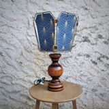 Table lamp, old turned wooden foot, metal lampshade and art deco print