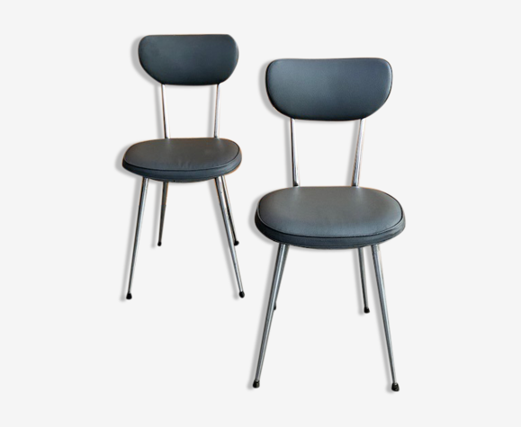 Chaises en skaï rembourré pieds fuselés inox