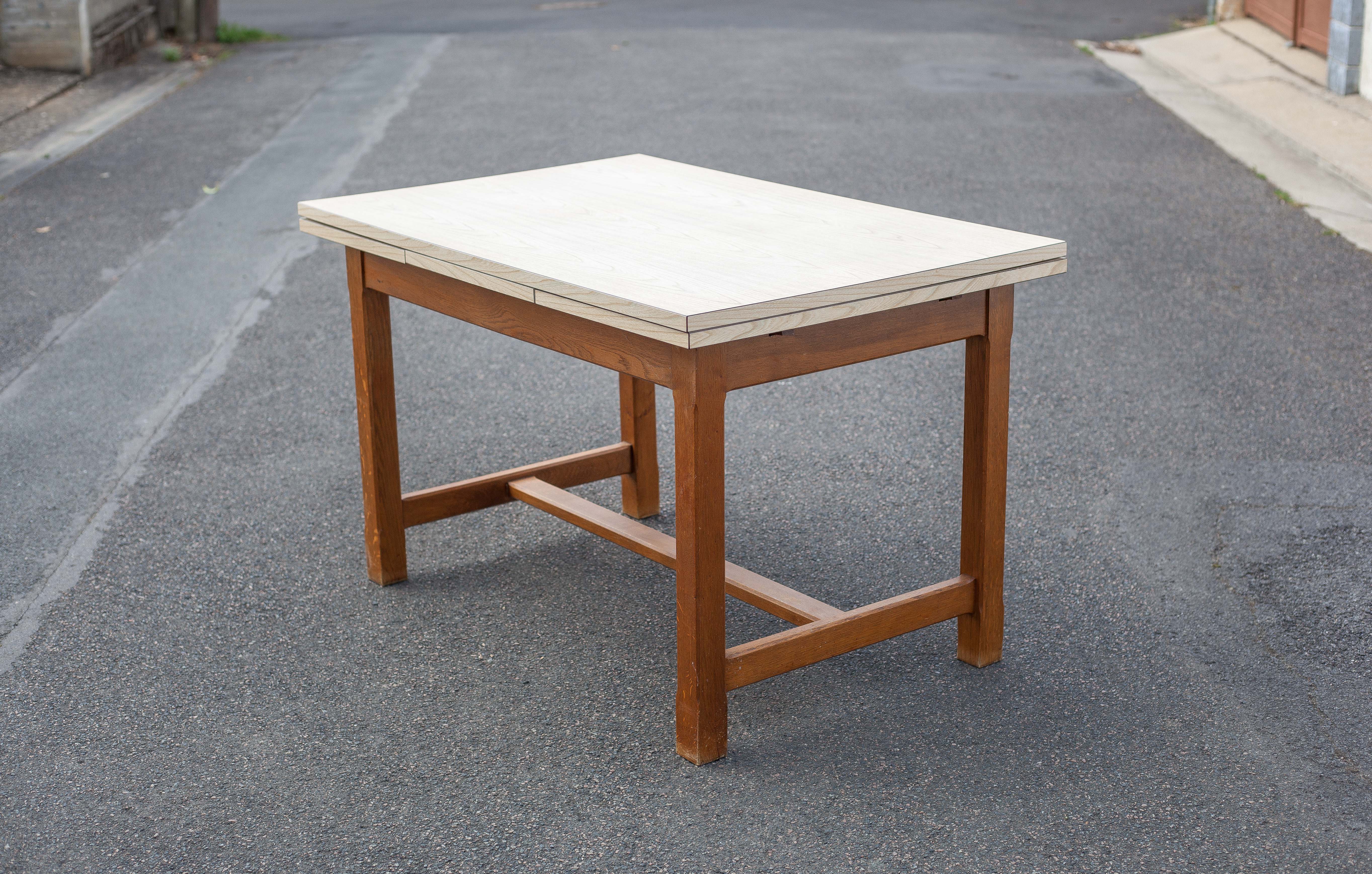 Wood and formica table with extensions