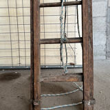 Very large vintage sliding wooden ladder