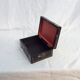 Old black wooden box adorned with roses with keys