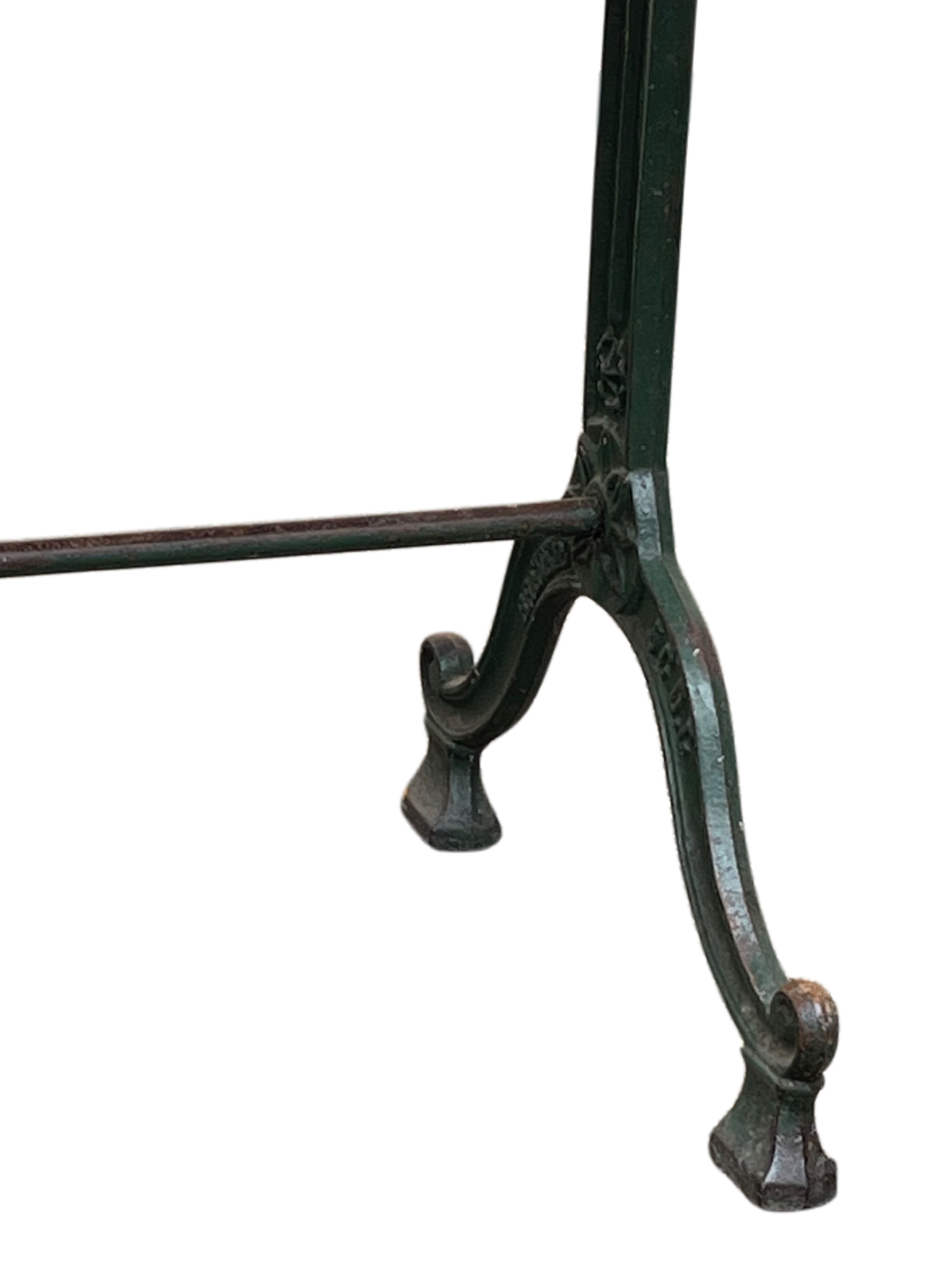 Old bistro table in engraved wrought iron
