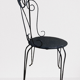 Pair of wrought iron garden chairs