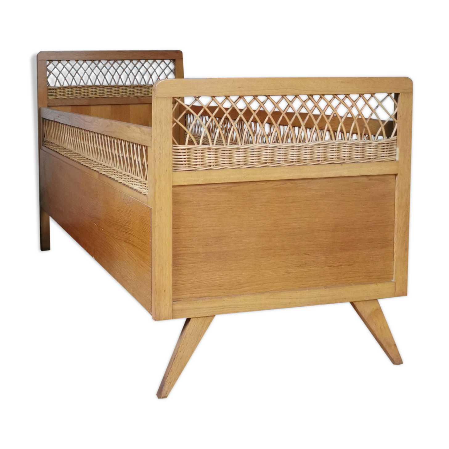 Vintage rattan child bed from the 60s