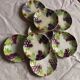 Set of eight flat dessert plates in barbotine earthenware with grape decoration – circa 1900.