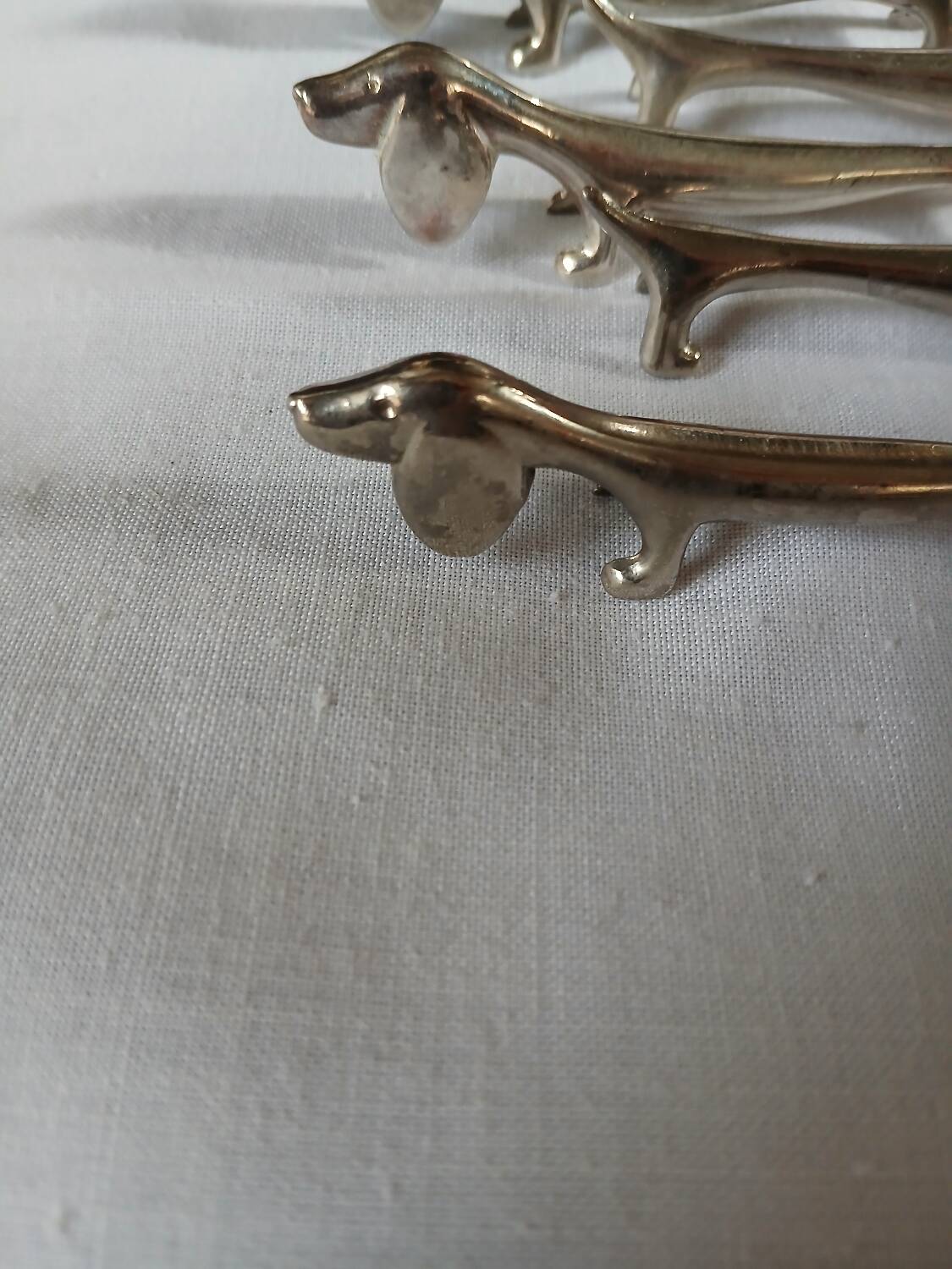 8 metal knife holders/dogs