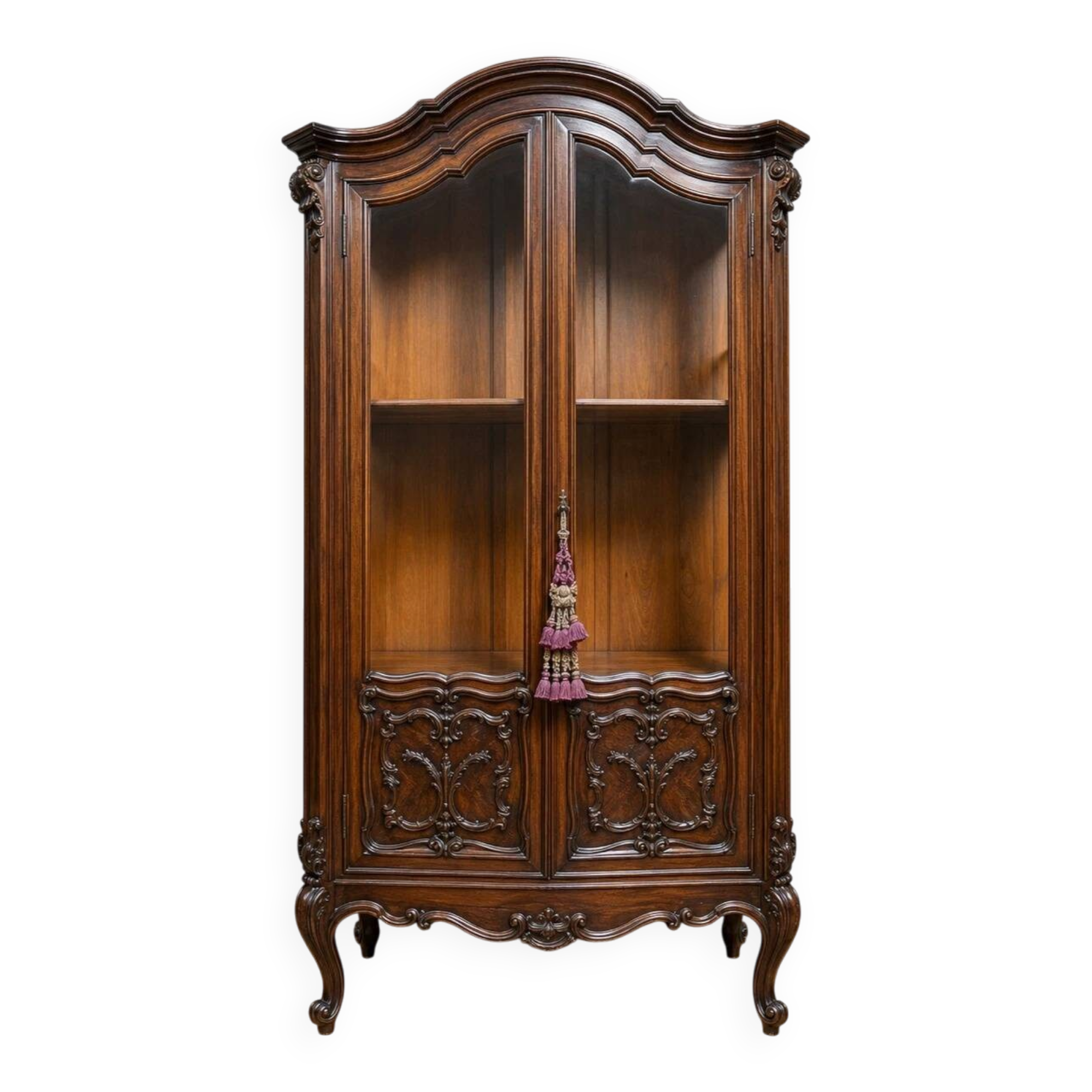 Curved library with two walnut doors, in Louis XV style.