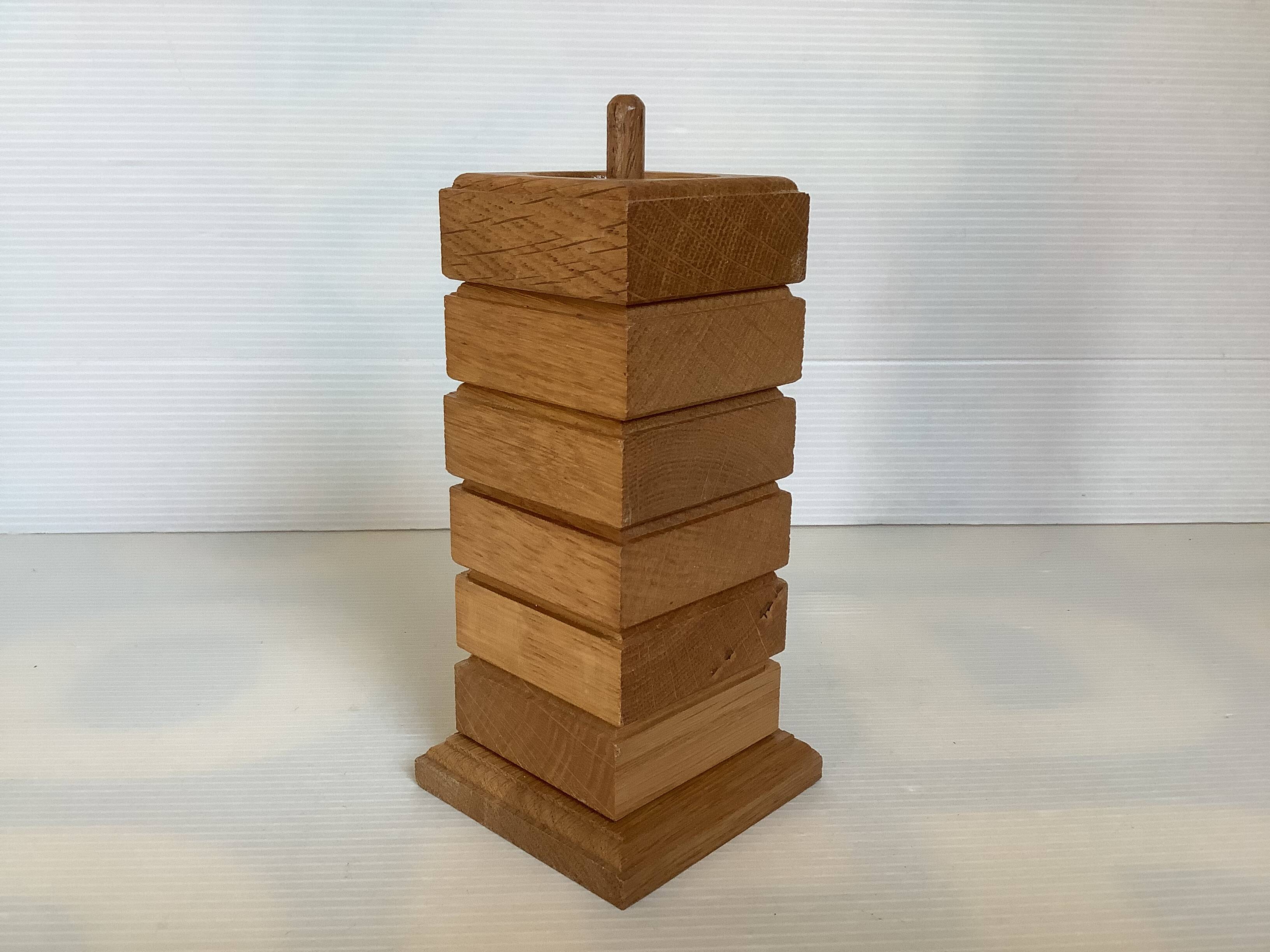 Six wooden egg cups and their Scandinavian style support