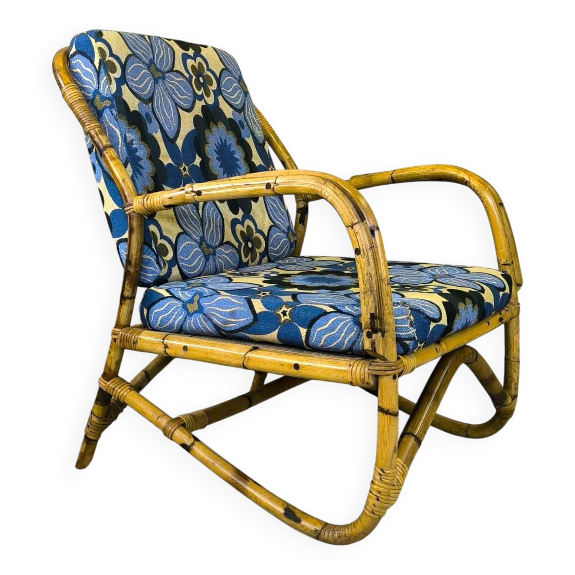 Vintage armchair in rattan and floral fabric