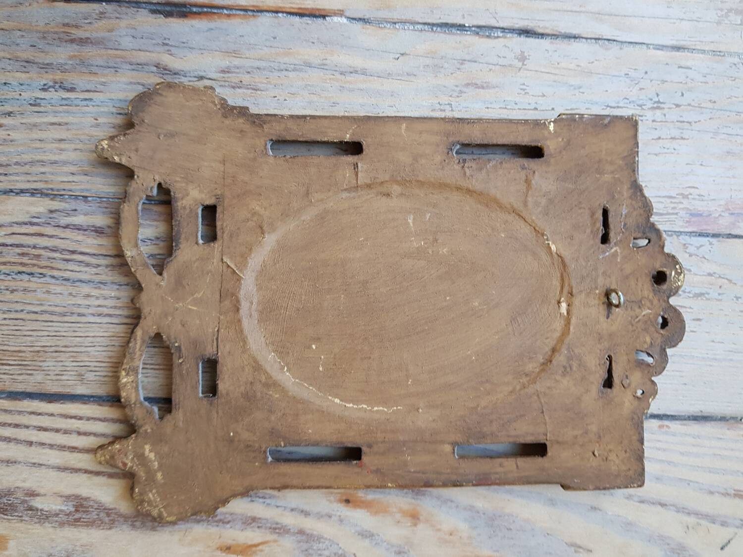 Old small golden mirror