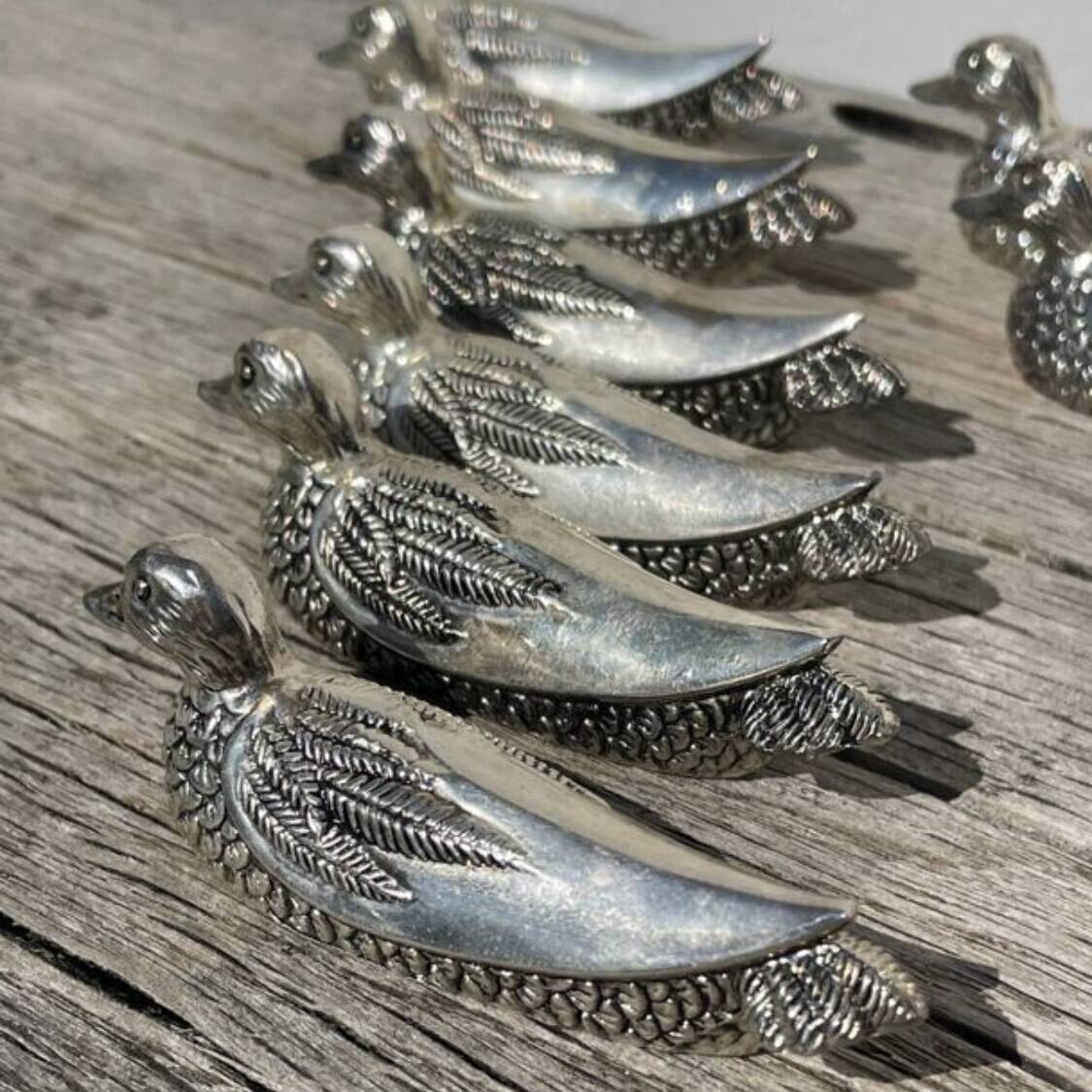 12 silver-plated metal knife rests with duck design