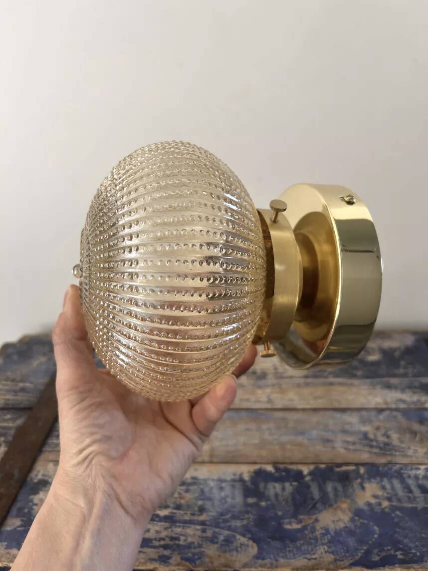 Golden globe wall light