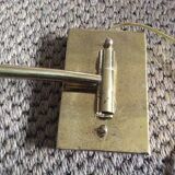 Wall lamp in gold metal