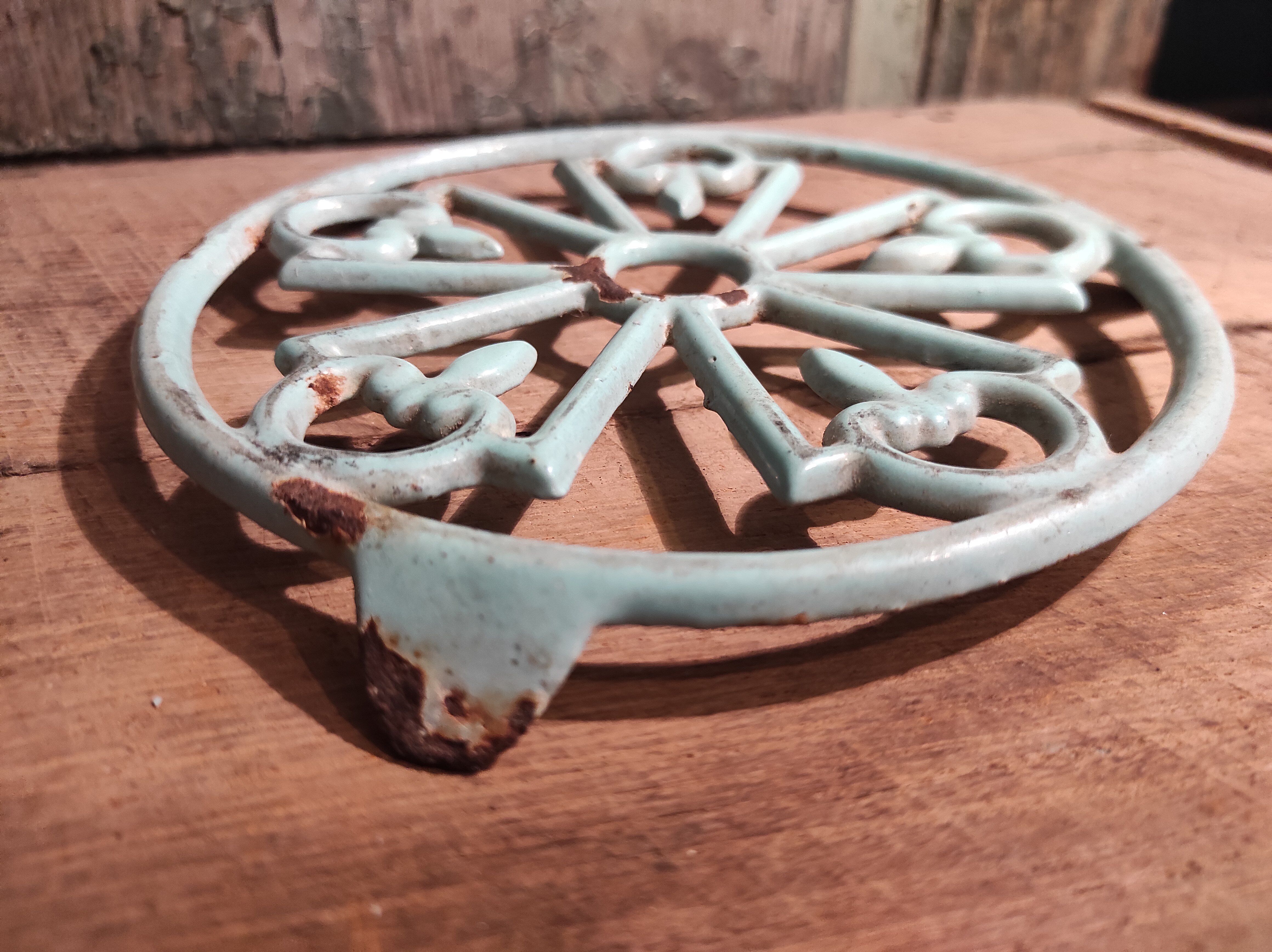 Vintage French light greenish blue cast iron table mat
