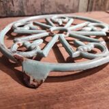 Vintage French light greenish blue cast iron table mat