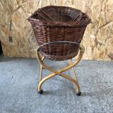 Old woven wicker baby cradle